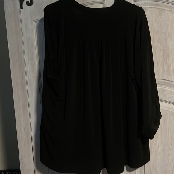 Do not fit anymore.  Thick black material shirt - Picture 3 of 4